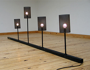 Four cylindrical perforated lamps Mathieu Mategot Swiss Pavilion